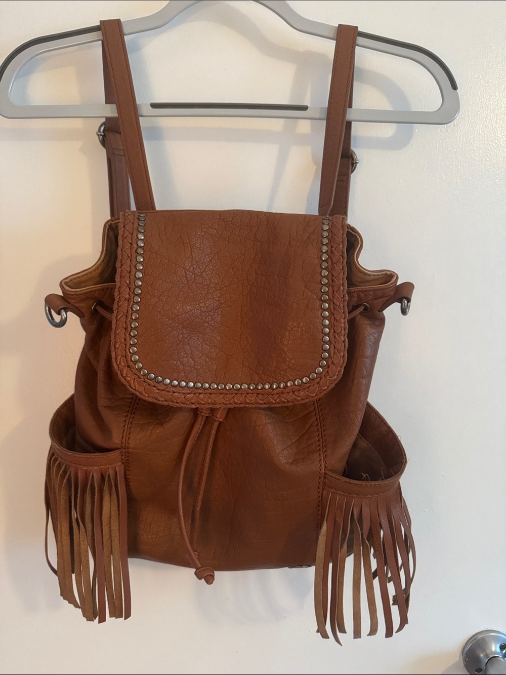 The Sak Brown Leather Fringe Backpack with Studded Flap